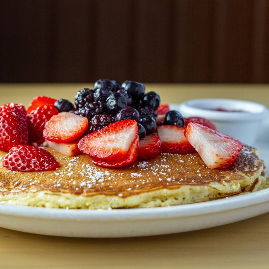 Pancake topped with fresh strawberries, blueberries and blackberries at Le Peep Valparaiso